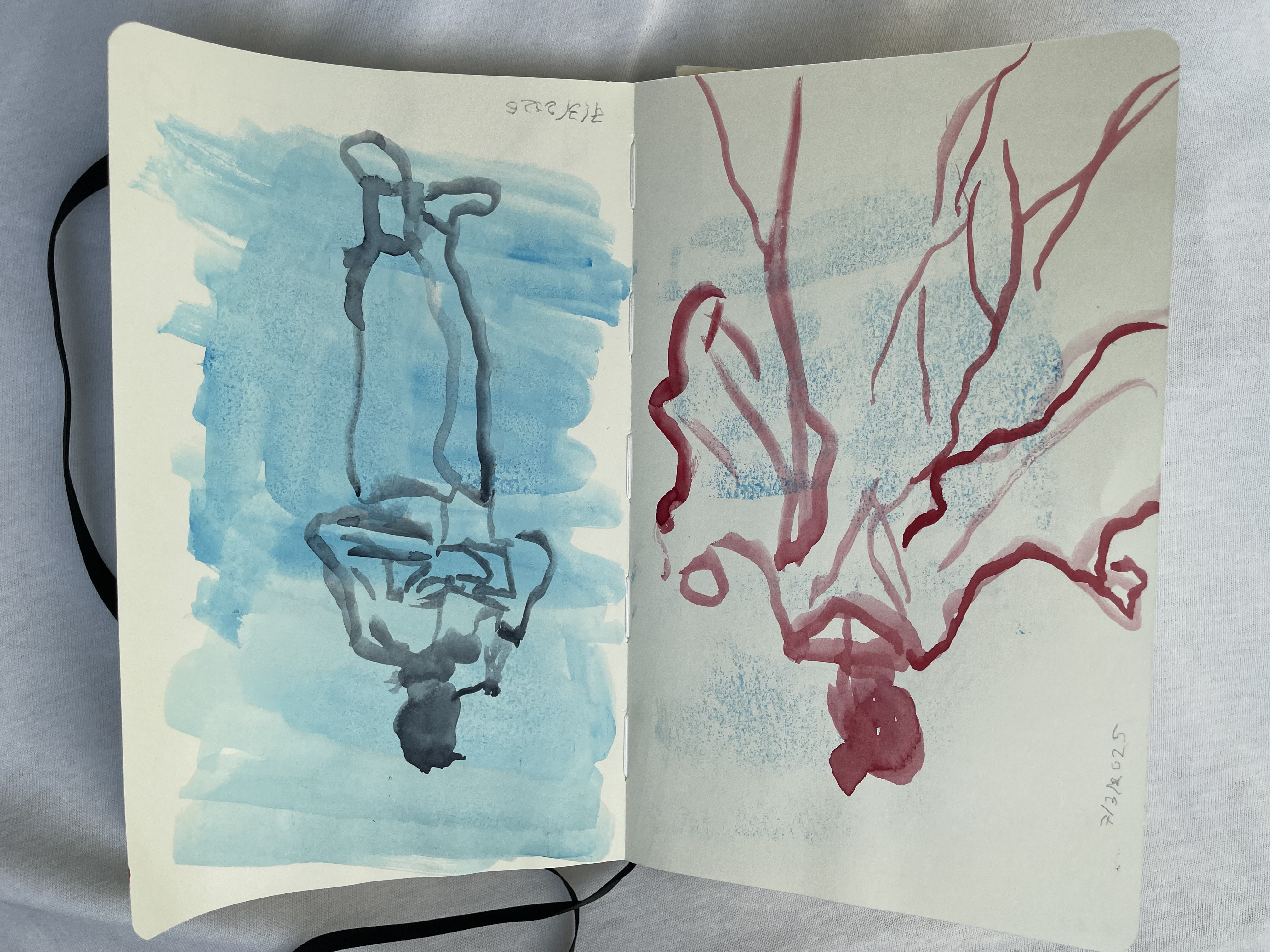Sketchbook spread, painted with my non-dominant hand. The left page is a line drawing in red of a lady in a flowy dress. The right page is a line drawing in dark blue on a light blue background of a young man smoking a pipe and holding a book.